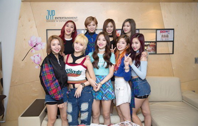 Girl group Twice’s Tzuyu (top, second left) was mired in a scandal involving China-Taiwan relations in January. (JYP Entertainment)