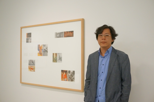 Park Chan-kyong poses with his work at Tina Kim Gallery in New York on May 5. (Lee Woo-young/The Korea Herald)