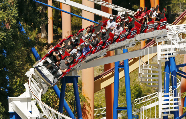 Samsung is a sponsor of the New Revolution at Six Flags Magic Mountain, a roller coaster that puts virtual reality goggles on riders so they can get a sensation of flying through space. (Los Angeles Times/TNS)