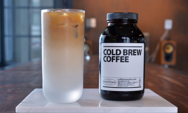 Coffee M Work’s cold-brewed latte is crafted from house-roasted Ethiopia Koke Honey beans that have been extracted for six to eight hours and then aged three days in a wine refrigerator. (Lee Sang-sub/The Korea Herald)