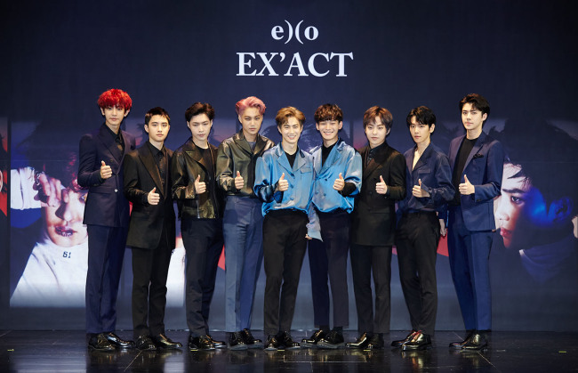 K-pop boy band EXO poses at a press conference Wednesday at SMTOWN@coexartium in Samseong-dong, Seoul. (S.M. Entertainment)