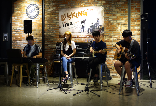 Indie band Uhikooya performs at a busking station set up inside CGV cinema in Yeouido on Sunday afternoon. (Rumy Doo/The Korea Herald)