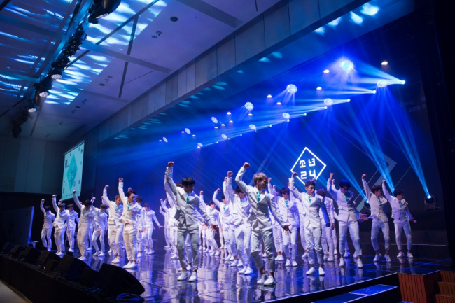 The 49 contestants of “Boys 24” give a dance performance at a press conference for the new audition program’s launch in Seoul on Thursday. (CJ E&M)