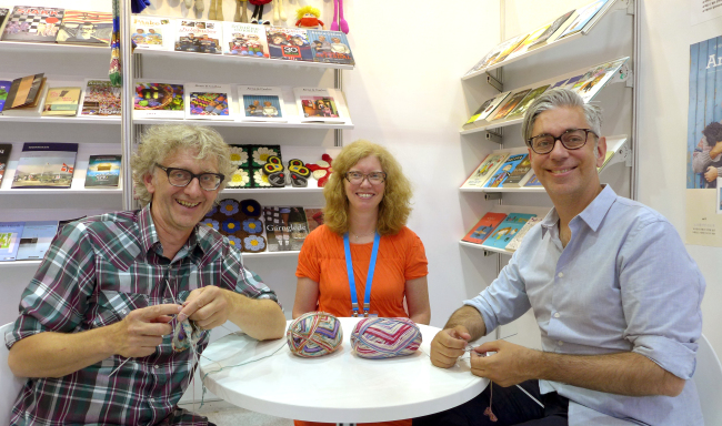 Norwegian book specialist Andrine Pollen (center) and knitwear designers Arne Nerjordet (left) and Carlos Zachrison pose at the Seoul International Book Fair 2016 at Coex in Seoul. (Joel Lee / The Korea Herald)