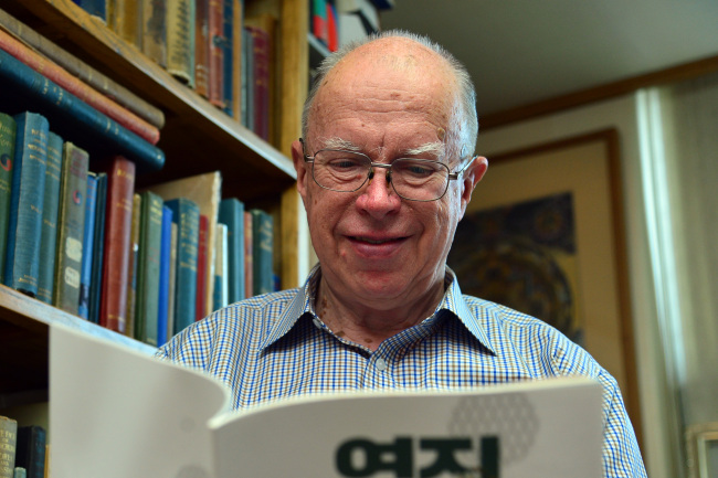 Brother Anthony, professor emeritus at Sogang University and translator of Korean poetry, sits in his study in Seoul on June 17. (Yoon Byung-chan/The Korea Herald)