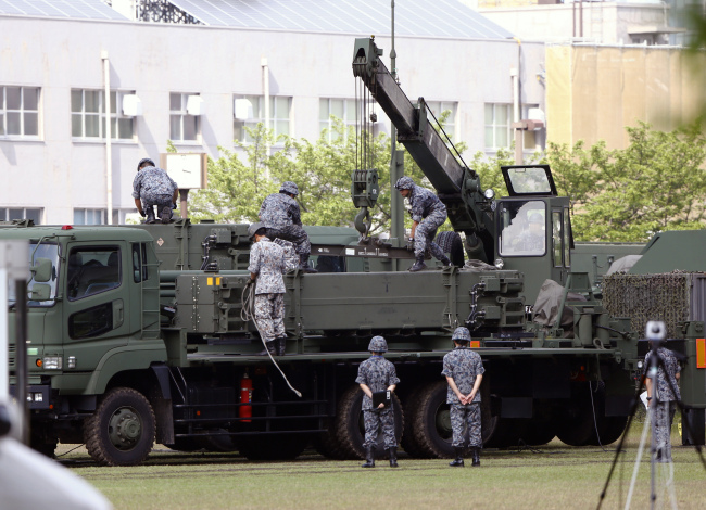 Japan's Ground Self-Defense Force on Tuesday prepare the launch of a Patriot Advanced Capability-3 interceptor unit deployed to counter North Korea's possible launch of a ballistic missile in Tokyo. (Yonhap)