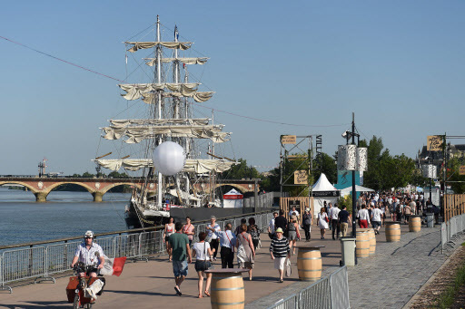 People attend the Bordeaux Wine Festival on June 23 along the Garonne River. (AFP-Yonhap)