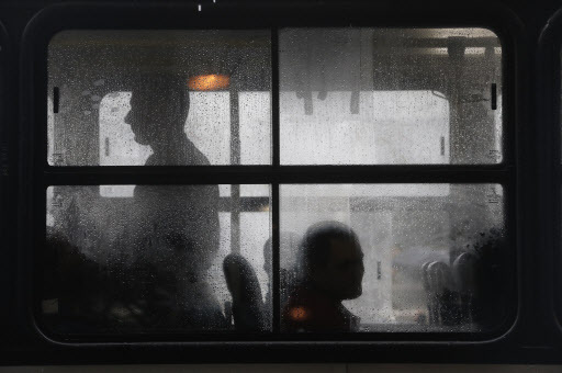 Commuters take their seats in buses operating during a 24-hour bus strike in Rio de Janeiro, Brazil, on May 28, 2014. (AP-Yonhap)