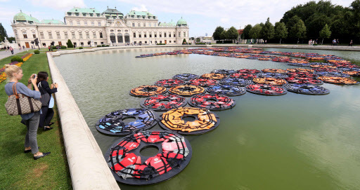 The installation “F Lotus” by Chinese artist Ai Weiwei for the exhibition “Translocation- transformation” features life vests floating on the pond at the Upper Belvedere palace in Vienna, Austria, Wednesday. (AP-Yonhap)