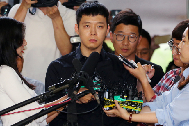 K-pop group JYJ member Park Yoo-chun arrives at Gangnam Police Office for questioning on allegations of sexual assault on June 30. (Yonhap)