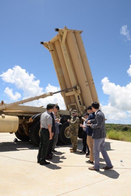 Reporters take a look at the THAAD battery during a tour to the Anderson air base in Guam on Monday. (The U.S. Air Force's 36th Wing)