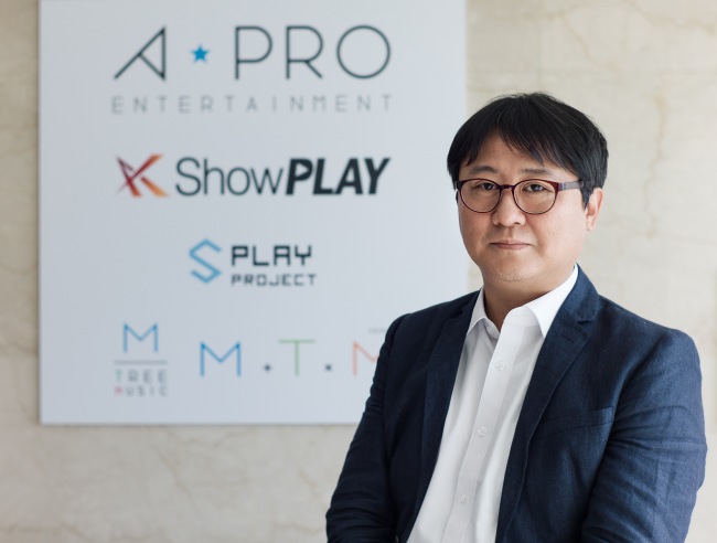 Shin Jae-hong, composer and chairman of M Tree Music, the first Korea-U.K. collaborative entertainment agency, poses for a photo at his Seoul office in July. (M Tree Music)