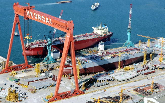Ships are being built at Hyundai Heavy Industries' docks. The Investor
