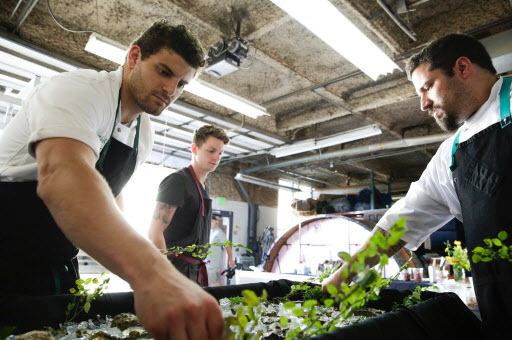 Herbal Chef CEO and head chef Chris Sayegh (left), assistant chef Michael Monteleone (center), and chef Dustin Selvaggio prepare an oyster appetizer for an event in Tacoma, Washington. (AFP-Yonhap)