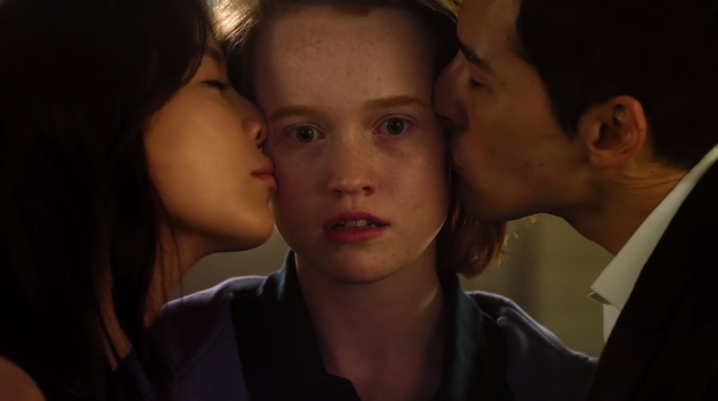 Australian actress Liv Hewson (center) stars as K-drama fan Claire Duncan in “Dramaworld.” (Netflix Korea)