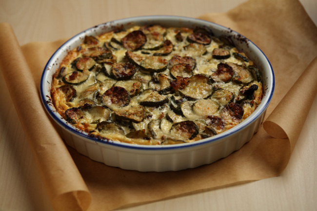 Garden-fresh zucchini is roasted to remove some of the moisture before being mixed into the filling for a savory summer tart. (Chicago Tribune/TNS)