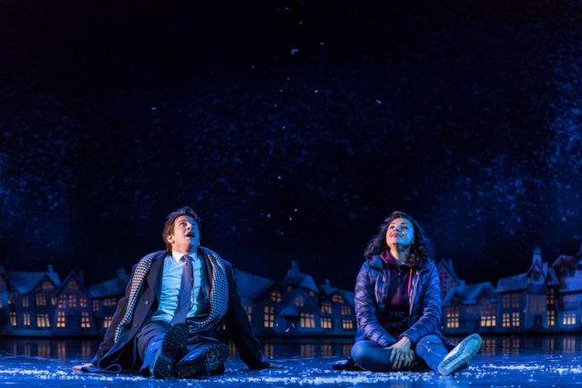 In this image provided by the Old Vic Theater in London shows Andy Karl portraying Phil Connors and Carlyss Peer, portraying Rita Hanson in the play Groundhog Day. (Manuel Harlan/Old Vic Theater via AP)