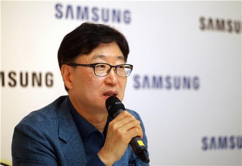 Yoon Boo-keun, president and CEO of Samsung's consumer electronics division, speaks at a news conference in Berlin on Friday.