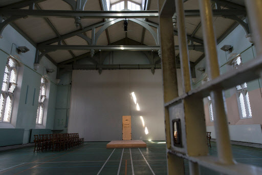 A view of an artwork by French artist Jean-Michel Pancin which replicates by way of the original door and exact dimensions the prison cell of author Oscar Wilde when he was incarcerated in Reading prison during an exhibition at the prison on Sept. 1. (AFP-Yonhap)