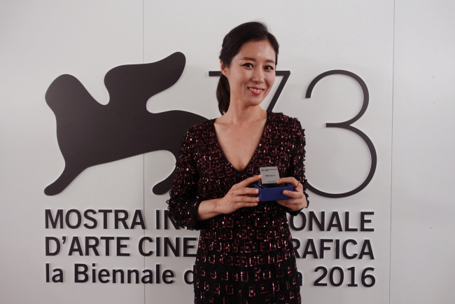 Actress Moon So-ri poses at the Venice International Film Festival in this photo released by her management agency. The actress won the Starlight Cinema Awards’ International Award at the film fest on Monday. (C-Jes Entertainment)