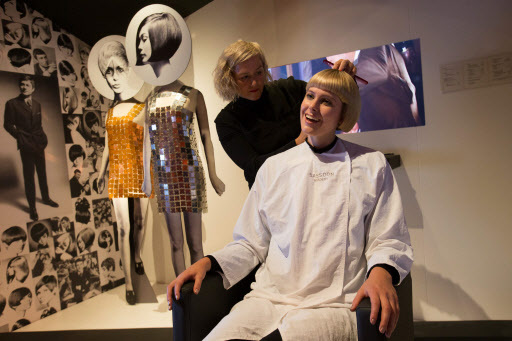 A model poses getting a 1960s hair style from a Sassoon stylist at a hair salon exhibit during a photo-call for the “You Say You Want a Revolution? Records and Rebels 1966-70” exhibition at the V&A museum in central London on Wednesday. (AFP-Yonhap)