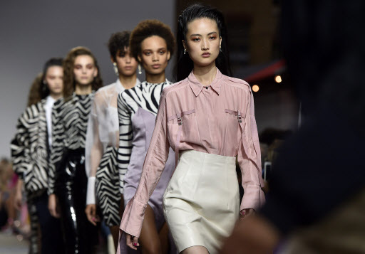 Models present creations from the Spring/Summer 2017 collection by Topshop as part of the Fashion East show during the London Fashion Week in London, Britain, Sunday. (EPA-Yonhap)