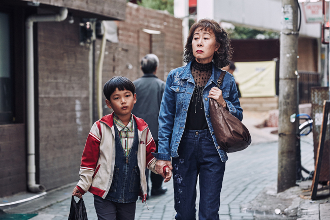 Ha Jeong-hoon (left) and Youn Yuh-jung star in “The Bacchus Lady.” (CGV Arthouse)
