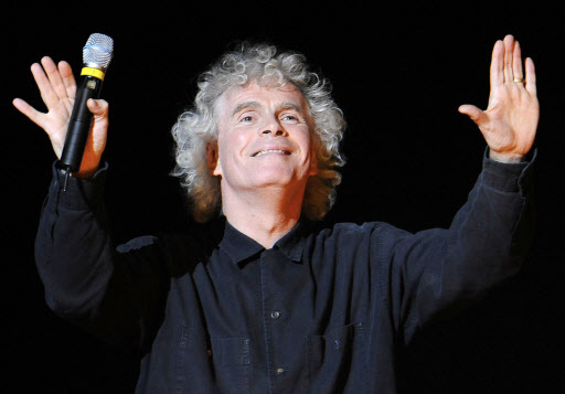 Conductor Sir Simon Rattle gestures prior to a dress rehearsal for Richard Wagner’s opera “Goetterdaemmerung,” which was part of the Salzburg Easter Festival in Salzburg, Austria. (AP-Yonhap)