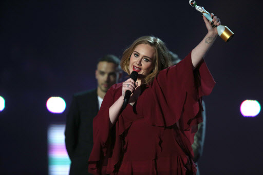 Adele holds the best British female solo artist award onstage at the Brit Awards 2016 at the 02 Arena in London. (AP-Yonhap)