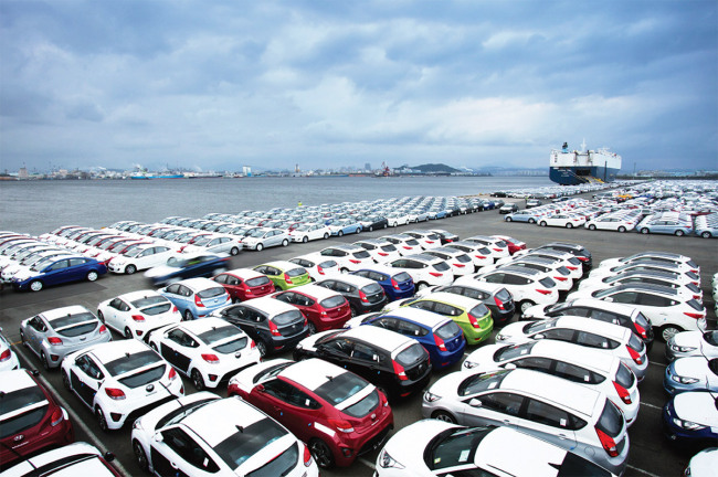 Hyundai Motor cars are parked at a port to be shipped.