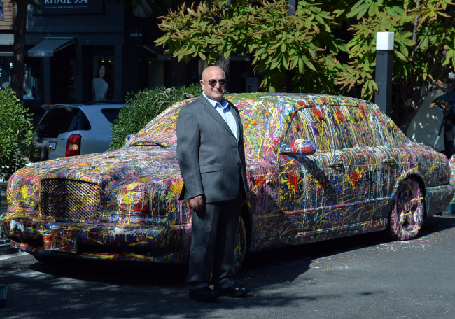 Artist-collector-dealer Fayez Barakat stands next to his artwork at the Barakat Seoul in Samcheong-dong, Seoul, on Monday. (Yoon Byung-chan/The Korea Herald)