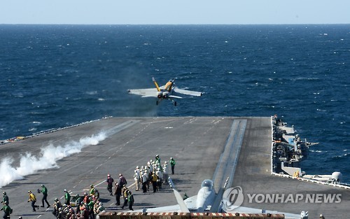 An F/A-18 Super Hornet fighter scrambles at nuclear-powered aircraft carrier USS Ronald Reagan. It arrives at a port in the southeastern coastal city of Busan on Oct. 30, 2015. Yonhap