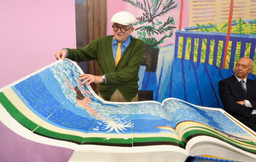 British artist David Hockney presents his large-format book “SUMO - A Bigger Book” at the stand of Taschen Publishing at the Frankfurt Book Fair, in Frankfurt am Main, Germany, Wednesday. (EPA-Yonhap)