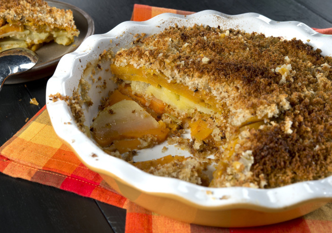 Parmesan sage crusted sweet potato gratin combines slices of Yukon gold with sweet potatoes in a layered, panko-topped dish. (Kansas City Star/TNS)