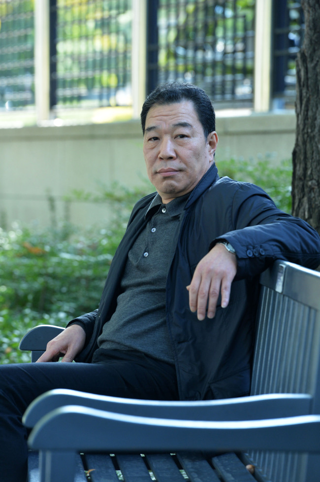 　Director Lee Min-yong, a judge at the North Korean Human Rights International Film Festival since its founding in 2011, poses for a photo in Gwanghwamun, Seoul, on Oct. 24. (Yoon Byung-chan/The Korea Herald)