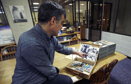 Pacey Foster, a rap historian and professor at UMass, reviews a collection of hip-hop cassette tapes and memorabilia from the 1980s at the Boston campus of the University of Massachusetts in Boston, Thursday. (AP-Yonhap)