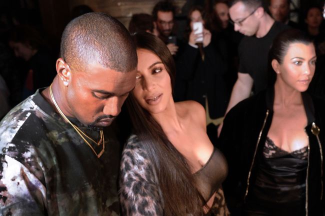 (From left) Kanye West, Kim Kardashian and Kourtney Kardashian attending the Off-white 2017 Spring/Summer ready-to-wear collection fashion show in Paris on Sept. 29 (AFP-Yonhap)
