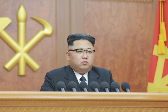 Kim Jong-un delivers his New Year's address at the Workers' Party Office (Yonhap)