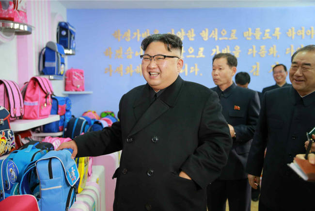 Kim Jong-un visits a newly constructed bag factory, marking his first inspection this year (Yonhap)