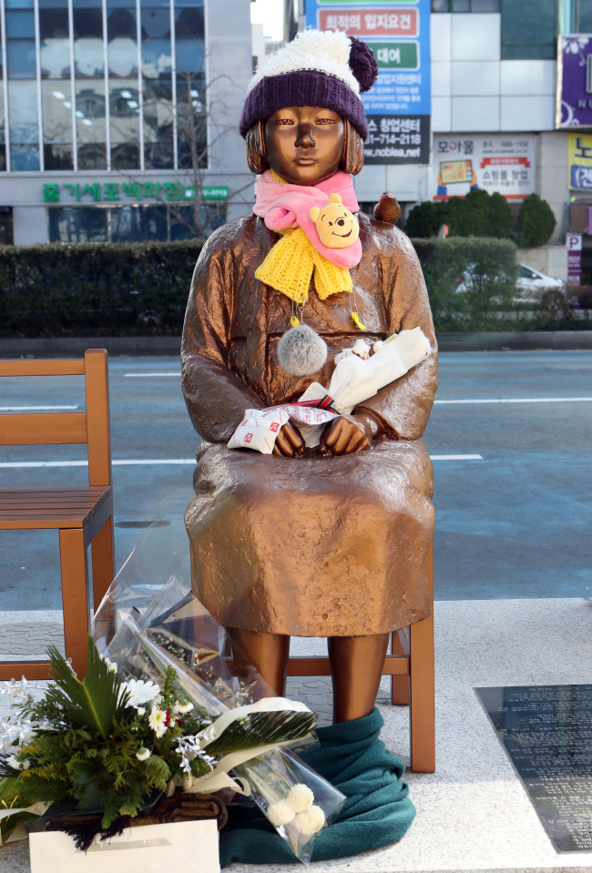 'Comfort women' statue installed at the end of last year by a civic group in front the Japanese Consulate General building in in Busan (Yonhap)