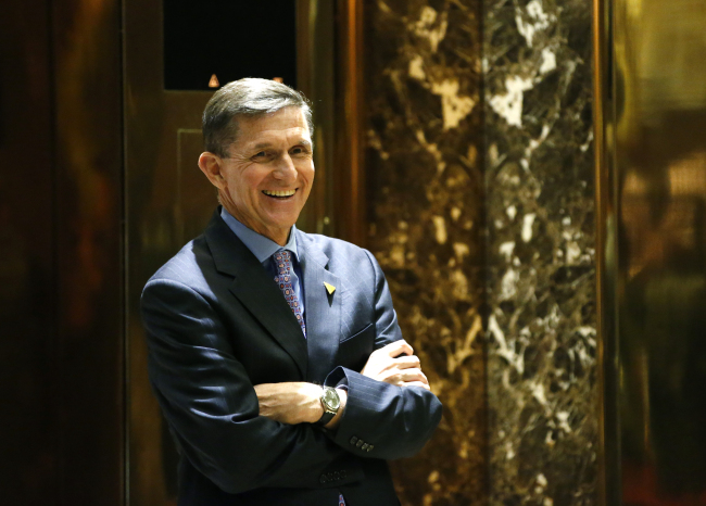 National Security Adviser-designate Michael Flynn waits for an elevator at Trump Tower in New York (Yonhap)