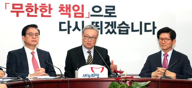Saenuri Party's interim head In Myung-jin (center) says Thursday the party will launch its internal ethics committee (Yonhap)