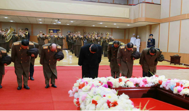Kim Jong-un along with party officials pays tribute at the memorial service of director-general Kang Ki-sop of the General Administration of Civil Aviation (Yonhap)