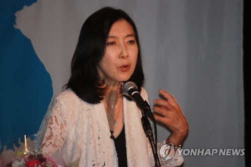 Shin Eun-mi, a Korean-American woman who was expelled from South Korea for her pro-North Korea remarks in 2014, gives a talk in Tokyo, Japan (Yonhap)