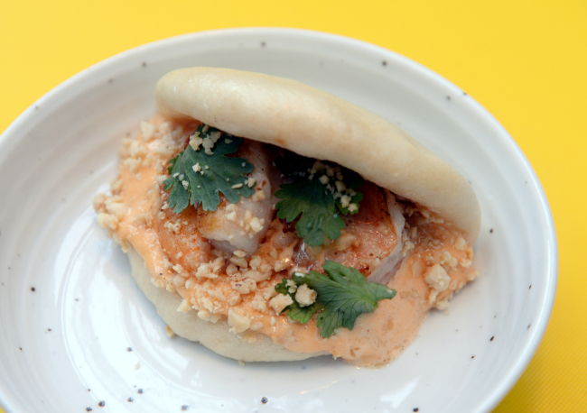 Bao27’s shrimp bao features smoky shrimp draped with sriracha mayo, cilantro and crushed peanuts in a housemade steamed bun. (Park Hyun-koo/The Korea Herald)