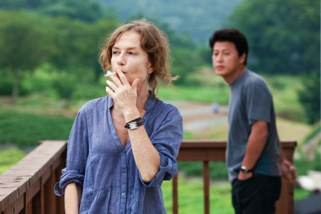 A still of the film “In Another Country,” depicting Isabelle Huppert (Jeonwonsa Films)