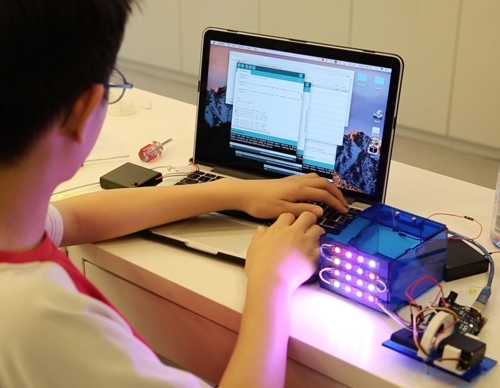 This photo provided by Code Academy on May 17, 2017, shows a student working on programming at the private institute in southern Seoul. (Yonhap)