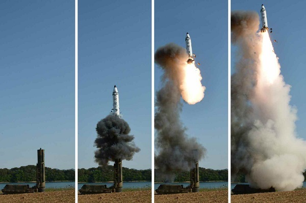 A set of photos carried by North Korea's main newspaper, the Rodong Sinmun, on May 22, 2017, shows the test-firing of a new intermediate-range ballistic missile, known as the Pukguksong-2, in North Korea. (For Use Only in the Republic of Korea. No Redistribution) (Yonhap)