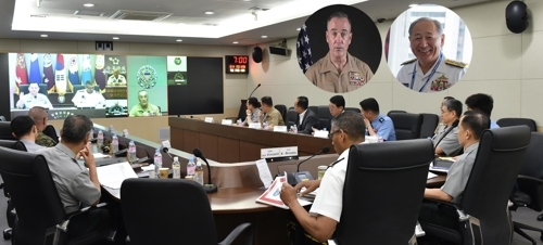 Army Gen. Lee Sun-jin, chairman of South Korea's Joint Chiefs of Staff, holds a video conference with his American and Japanese counterparts -- Gen. Joseph F. Dunford and Adm. Katsutoshi Kawano -- on May 23, 2017, in this photo provided by Lee's office. (Yonhap)
