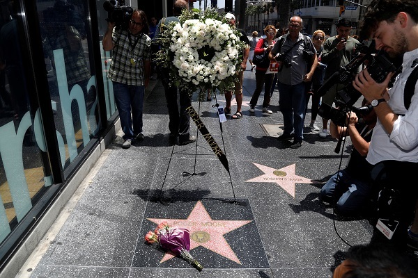 Flowers are pictured on the star of late actor Roger Moore on the Hollywood Walk of Fame in Los Angeles, California US, May 23, 2017. (Reuters)